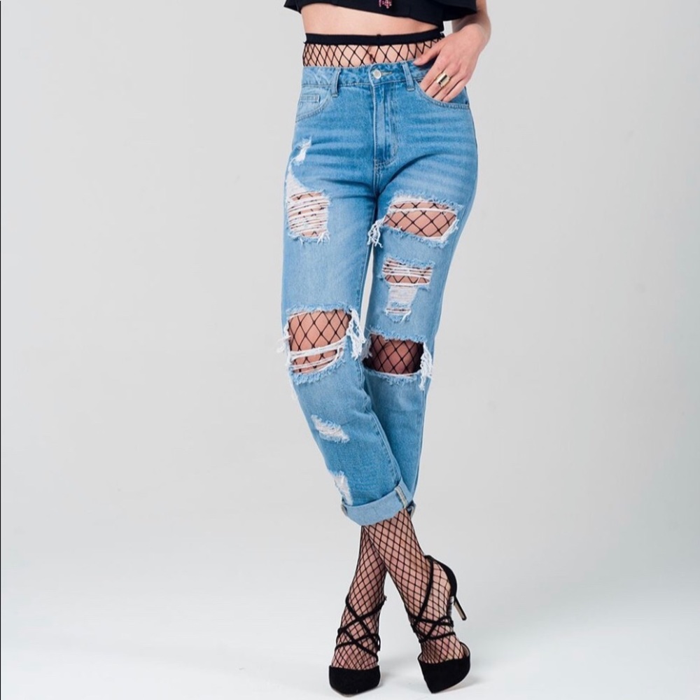 Ripped jeans with fishnet tights